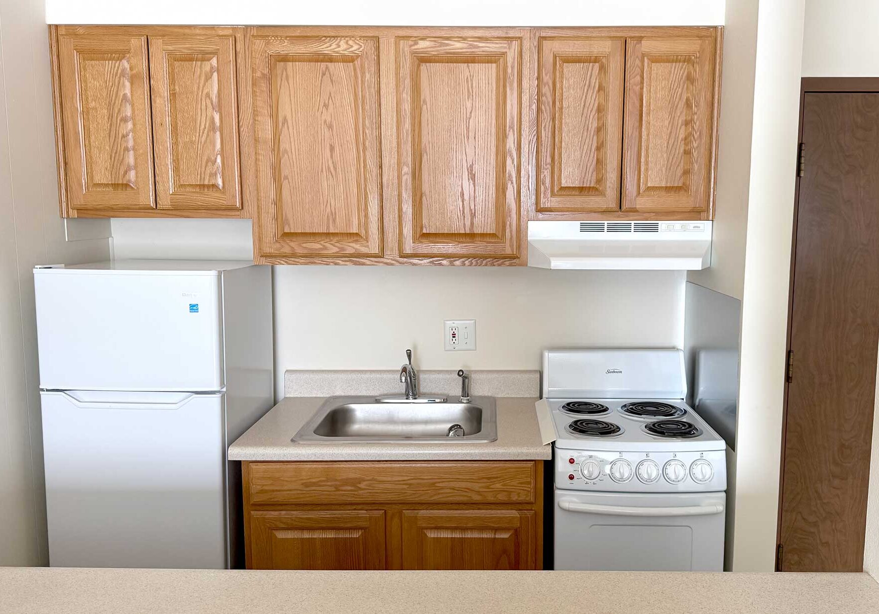 A kitchen with appliances at Village Green west apartments